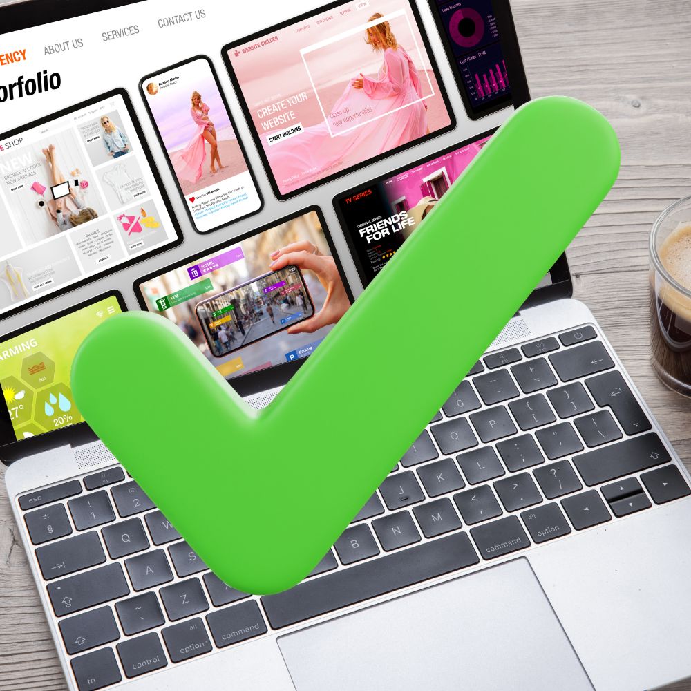 Great website laptop with a website on the screen and a green tick over the image because there are no website mistakes